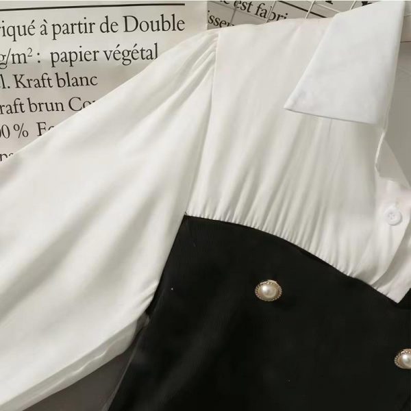 Contrast-Panel Top – Featuring Pearl Button Accents, a Flattering Peplum Silhouette, and a Timeless Black & White Palette